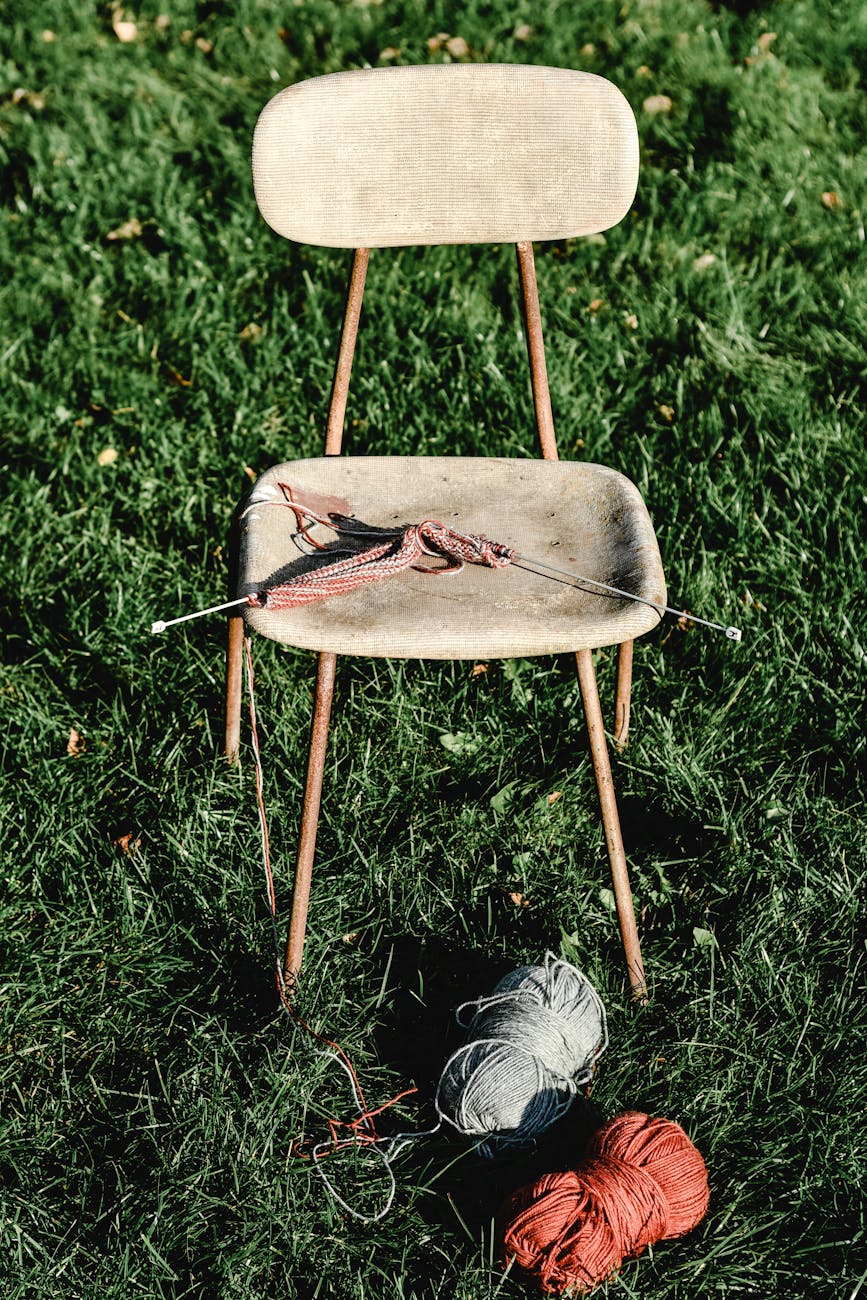 knitting needles on a chair